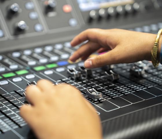 Hands on a sound desk